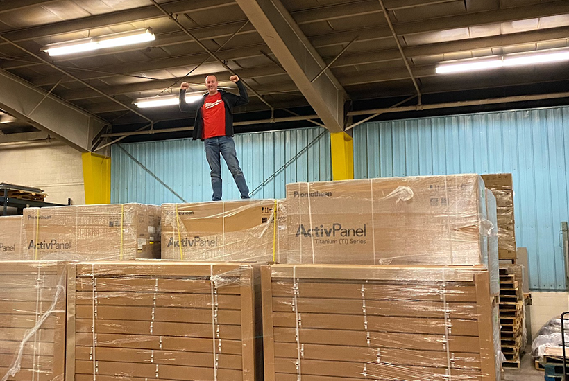 Empower Team standing atop Promethean boxes